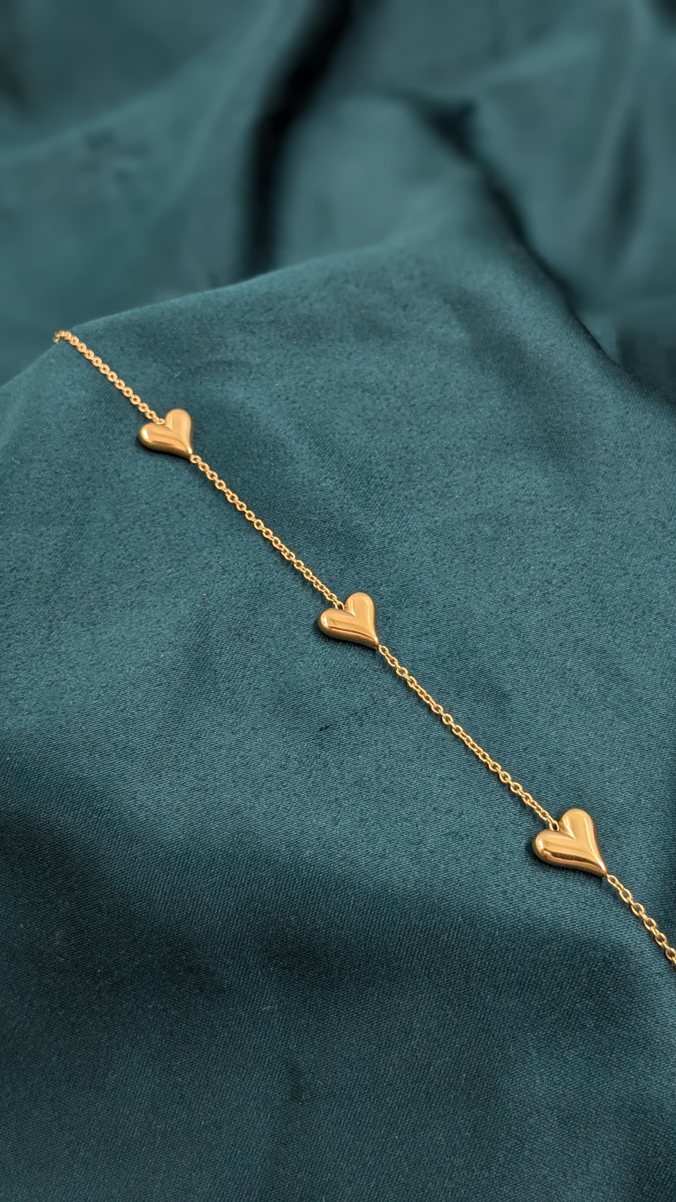 three-heart charm bracelet